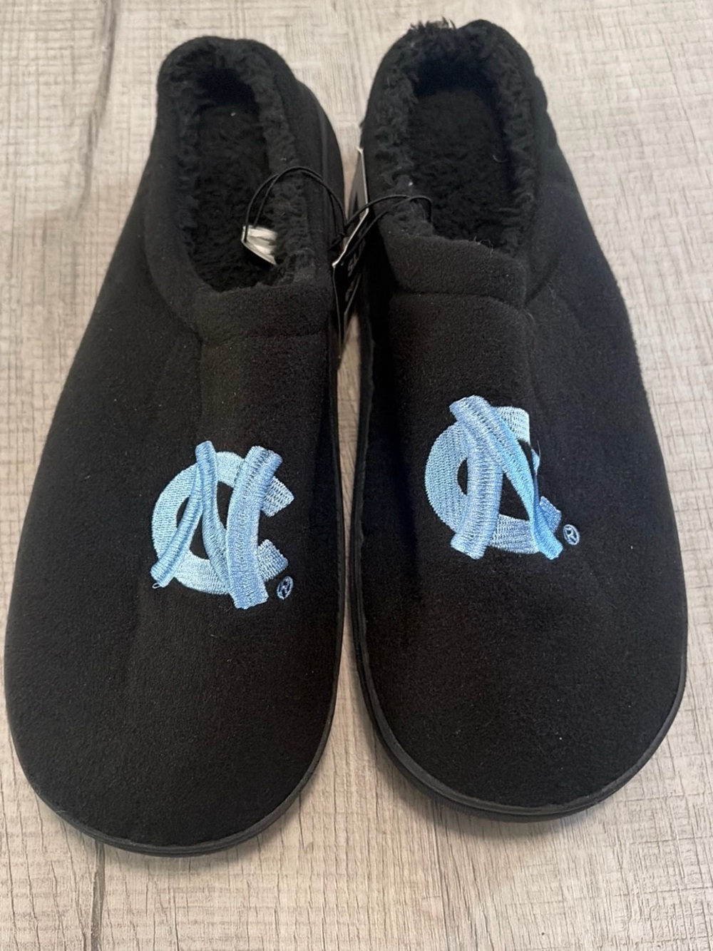 NCAA Black Slip-On House Shoes with Light Blue UNC Logo